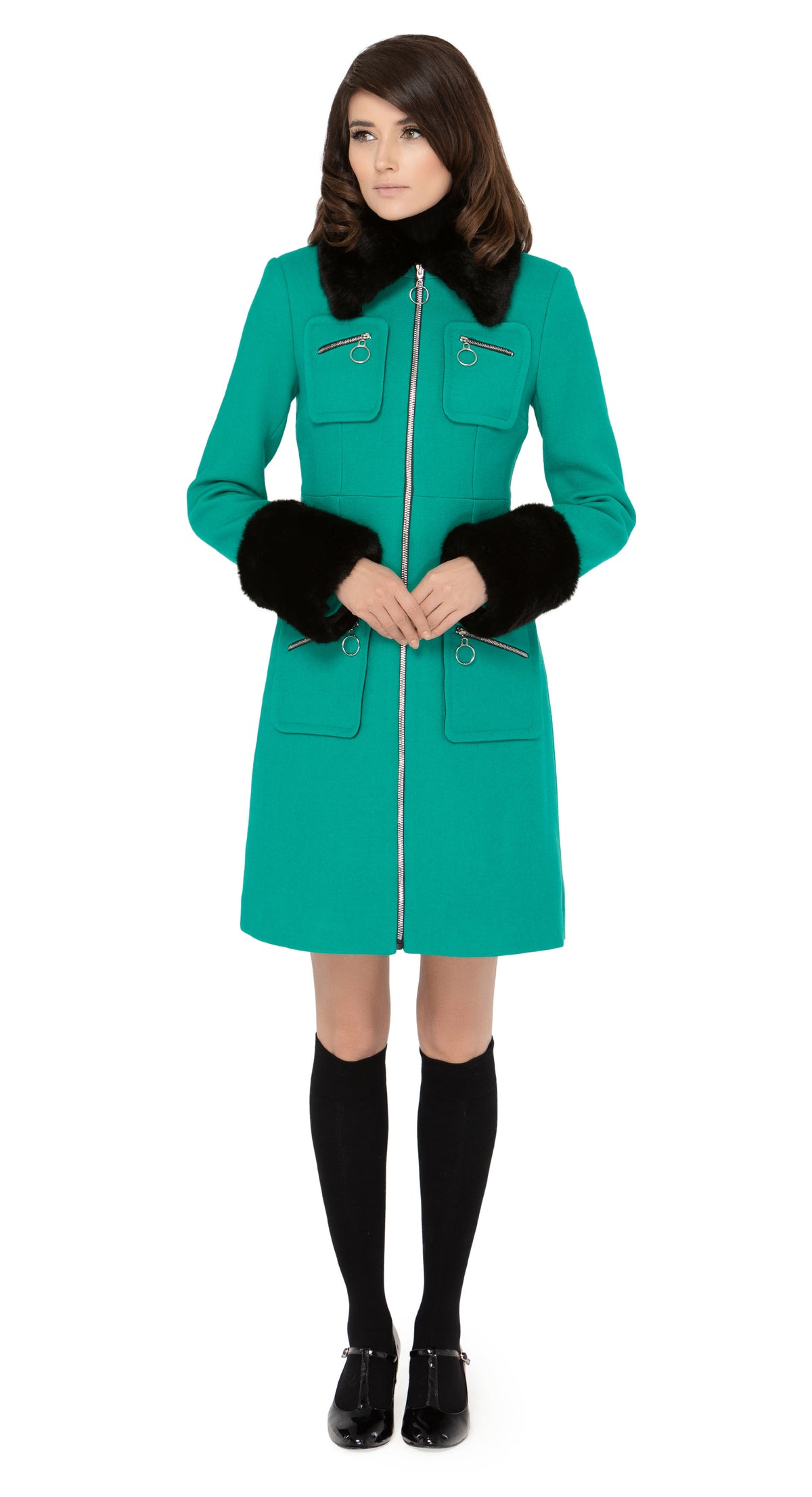 Impeccably crafted sixties style fitted, fair weather coat in a strikingly unique Italian wool blend. Fully lined with a detachable black faux fur collar and dramatic detachable cuffs. Retro loop zip front closure and four zip-up essentials pockets.  Pairs perfectly with our 1960s Style Skirt with Retro Loop Zipper Pull to create an as-intended high fashion set for all occasions.   Indistinguishable cruelty-free faux fur detailing attaches and removes simply to add versatility to the coat across seasons.