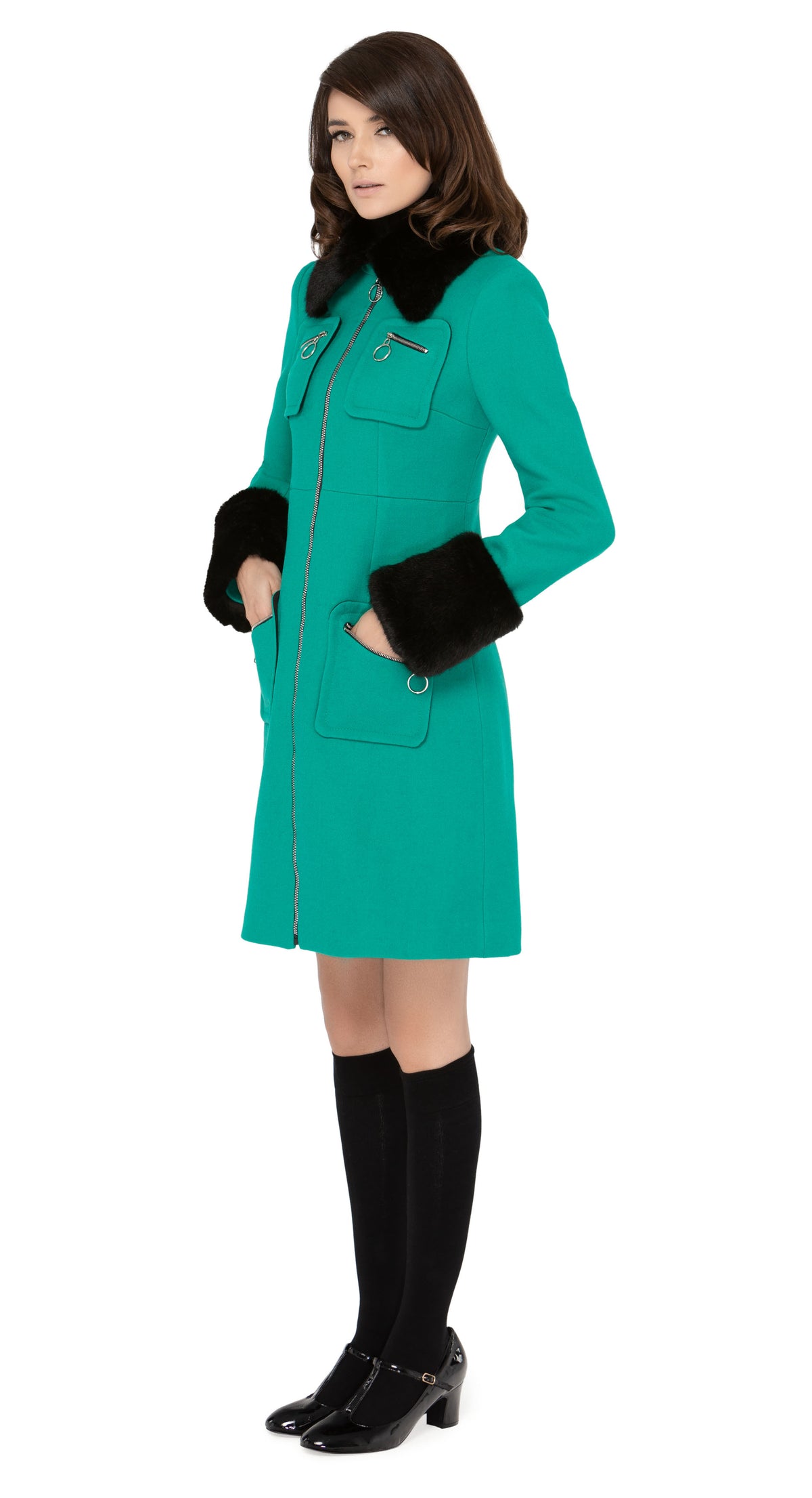 Impeccably crafted sixties style fitted, fair weather coat in a strikingly unique Italian wool blend. Fully lined with a detachable black faux fur collar and dramatic detachable cuffs. Retro loop zip front closure and four zip-up essentials pockets.  Pairs perfectly with our 1960s Style Skirt with Retro Loop Zipper Pull to create an as-intended high fashion set for all occasions.   Indistinguishable cruelty-free faux fur detailing attaches and removes simply to add versatility to the coat across seasons.