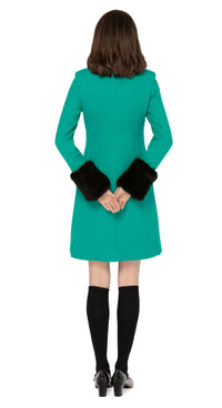 Impeccably crafted sixties style fitted, fair weather coat in a strikingly unique Italian wool blend. Fully lined with a detachable black faux fur collar and dramatic detachable cuffs. Retro loop zip front closure and four zip-up essentials pockets.  Pairs perfectly with our 1960s Style Skirt with Retro Loop Zipper Pull to create an as-intended high fashion set for all occasions.   Indistinguishable cruelty-free faux fur detailing attaches and removes simply to add versatility to the coat across seasons.