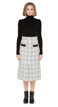 70s style autumn/winter work-or-play skirt in a timeless black/light cream, textured Spanish weave with front functioning essentials pockets and front pleat.  Pairs perfectly with our Retro Style Jacket with Detachable Faux Fur Collar and Cuffs to create a versatile high fashion set.  Choose bespoke to alternate to desired length such as a mini.  Shown here with classic black ribbed turtle neck which is sold separately. Please enquire to shop the full look.