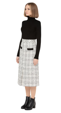 70s style autumn/winter work-or-play skirt in a timeless black/light cream, textured Spanish weave with front functioning essentials pockets and front pleat.  Pairs perfectly with our Retro Style Jacket with Detachable Faux Fur Collar and Cuffs to create a versatile high fashion set.  Choose bespoke to alternate to desired length such as a mini.  Shown here with classic black ribbed turtle neck which is sold separately. Please enquire to shop the full look.