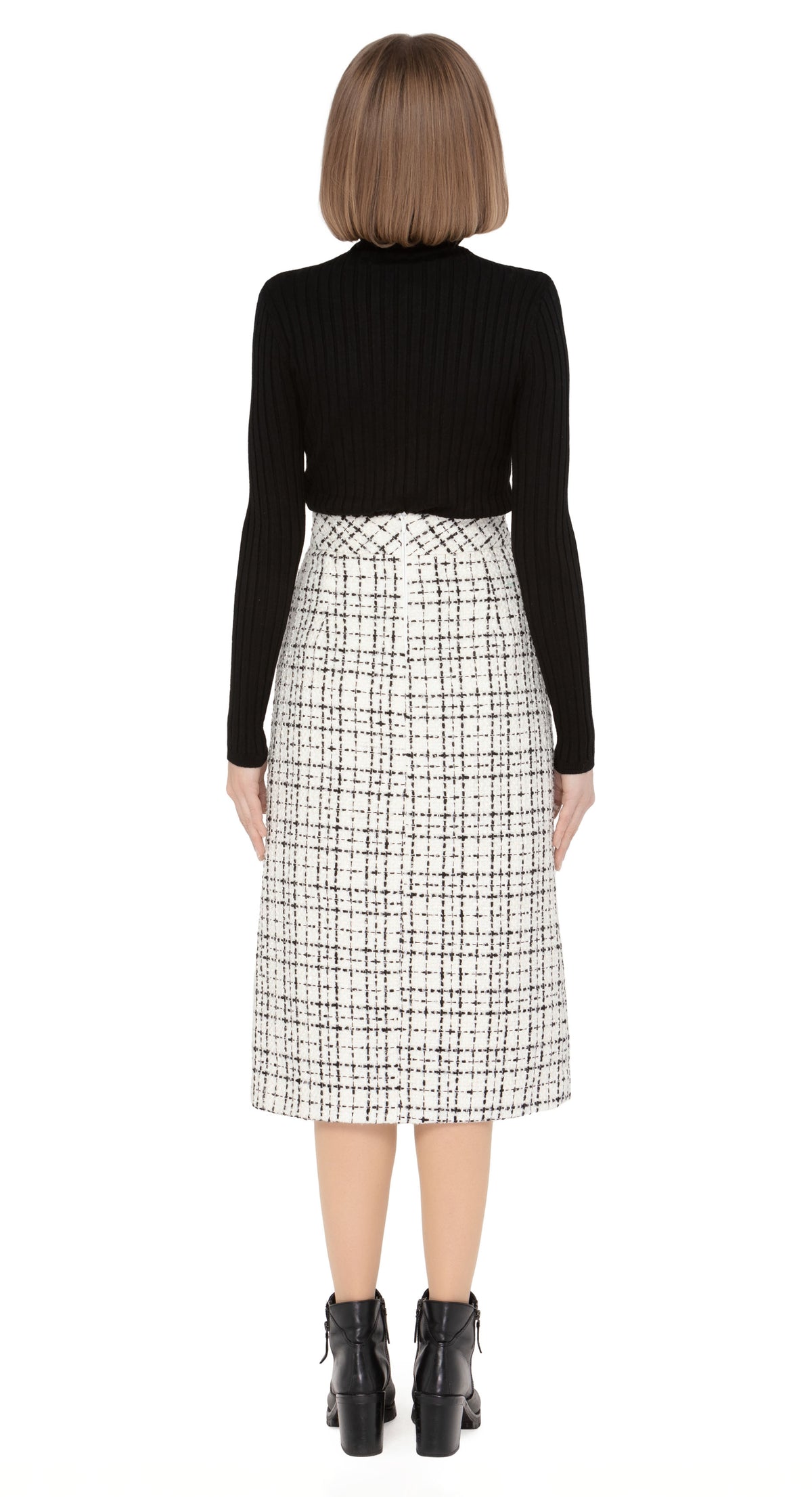 70s style autumn/winter work-or-play skirt in a timeless black/light cream, textured Spanish weave with front functioning essentials pockets and front pleat.  Pairs perfectly with our Retro Style Jacket with Detachable Faux Fur Collar and Cuffs to create a versatile high fashion set.  Choose bespoke to alternate to desired length such as a mini.  Shown here with classic black ribbed turtle neck which is sold separately. Please enquire to shop the full look.