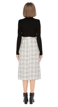 70s style autumn/winter work-or-play skirt in a timeless black/light cream, textured Spanish weave with front functioning essentials pockets and front pleat.  Pairs perfectly with our Retro Style Jacket with Detachable Faux Fur Collar and Cuffs to create a versatile high fashion set.  Choose bespoke to alternate to desired length such as a mini.  Shown here with classic black ribbed turtle neck which is sold separately. Please enquire to shop the full look.