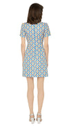 This classic, fitted sixties style spring floral dress produced in a luxury French mill weave in royal blue, pink, white, mustard yellow and navy-blue tones, with a classic stand up collar and short slightly puffed sleeves. It is designed with a zippered back closure for easy wear. The intricate detailing and exquisite craftsmanship make it a stunning piece. Perfect for a warm spring day, this dress is both stylish and comfortable.