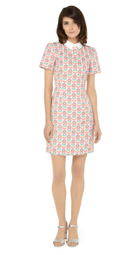 This classic, fitted sixties style spring floral fabric dress produced in a luxury French mill weave in white, peach, red, green, blue and yellow tones, with a classic stand up collar and short slightly puffed sleeves. It is designed with a zippered back closure for easy wear. The intricate detailing and exquisite craftsmanship make it a stunning piece. Perfect for a warm spring day, this dress is both stylish and comfortable.