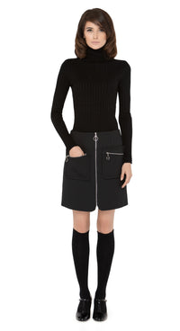 Marmalade zip up skirt in a classic black Italian fabric with functioning zip essentials pockets, retro loop zip pulls and front loop zip closure.  Shown here, worn with a classic ribbed black turtleneck and knee highs which are sold separately. Please enquire to shop the full look. Also available in emerald green.  Pairs perfectly as intended with our 1960s Style Coat with Detachable Faux Fur, to create an impacting set.