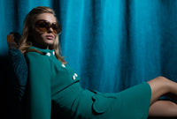 At work or play, fitted Spanish viscose/wool blend dress with unique heart shape functional pockets, delicate bow detailing and a slight cut out at the neckline. A very wearable and flattering style statement in a classical vintage green. A fully lined piece with back zipper closure.  Pairs perfectly with style our Vintage Green Jacket for a high fashion functional statement.  Choose bespoke to add desired sleeve length or for a different colour (please inquire).
