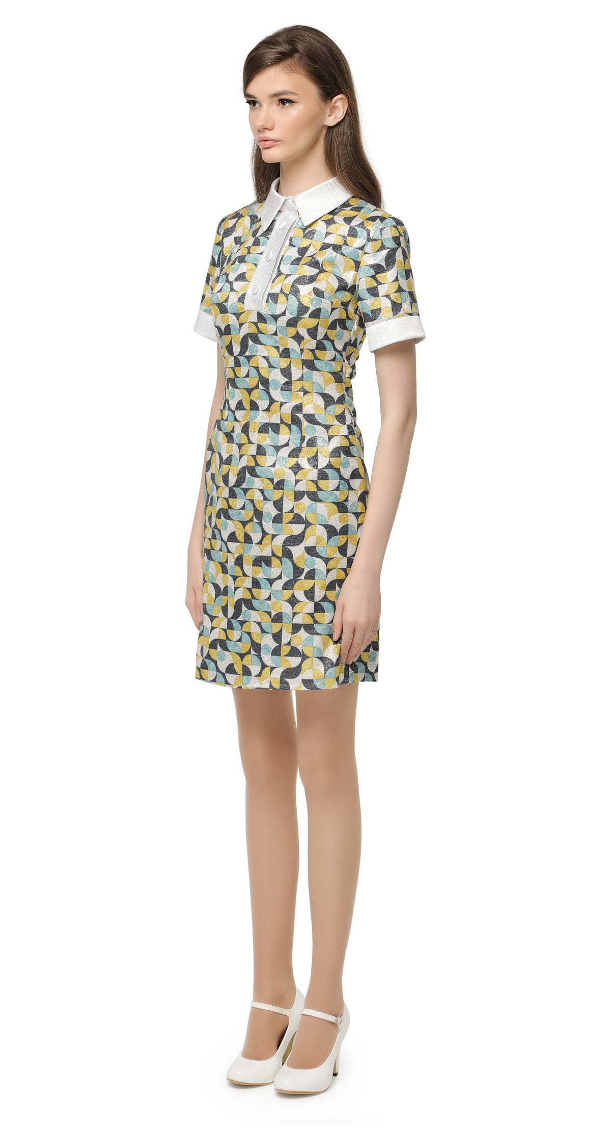 Fitted retro pattern dress with classic shirt collar and decorative four button closure. A stunningly beautiful French mill shimmering silver weave with a muted blue/yellow/dark blue/white geometric pattern. Perfect for a big night out; magnificent under the dance floor lights and confidently cool in any casual setting.   Choose bespoke for full sleeve and/or to alternate hem length.