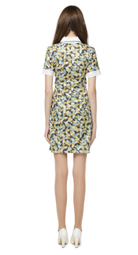 Fitted retro pattern dress with classic shirt collar and decorative four button closure. A stunningly beautiful French mill shimmering silver weave with a muted blue/yellow/dark blue/white geometric pattern. Perfect for a big night out; magnificent under the dance floor lights and confidently cool in any casual setting.   Choose bespoke for full sleeve and/or to alternate hem length.